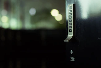 A smart lock steel door with a brushed silver finish, showcasing advanced security technology in a stylish design.