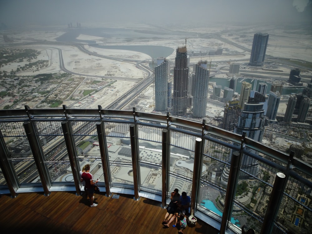 people sitting on high rise building