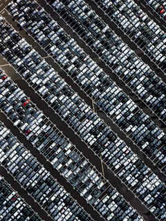 Aerial view of a large parking lot with crisp white and yellow painted lines
