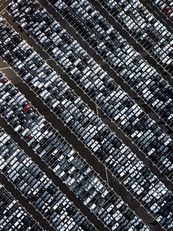 Aerial view of a busy parking lot showing cars entering and exiting smoothly.