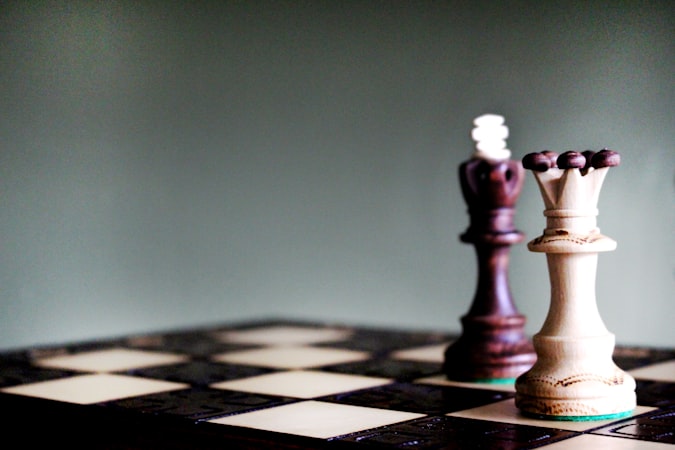 Smartphone displaying chess analytics dashboard with charts and statistics overlaid on a chess board