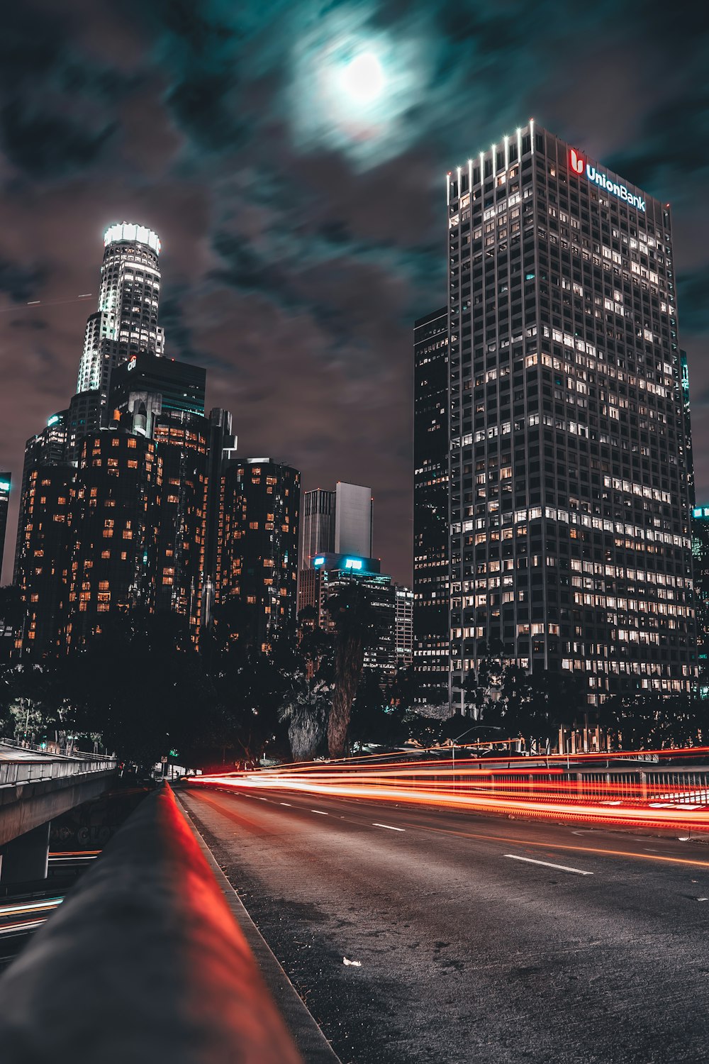 time lapse photo of cars passing on road