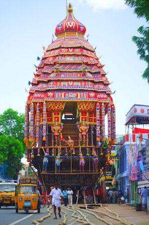 Crowds gathered around a temple chariot during a lively festival in South India.