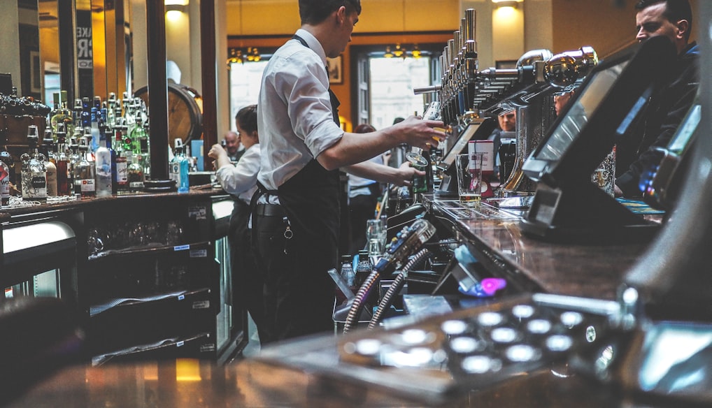 man preparing beverage drink in bar