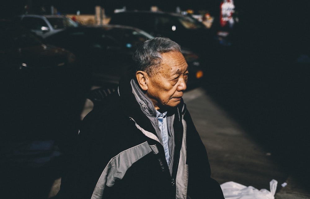 man standing near white plastic bag