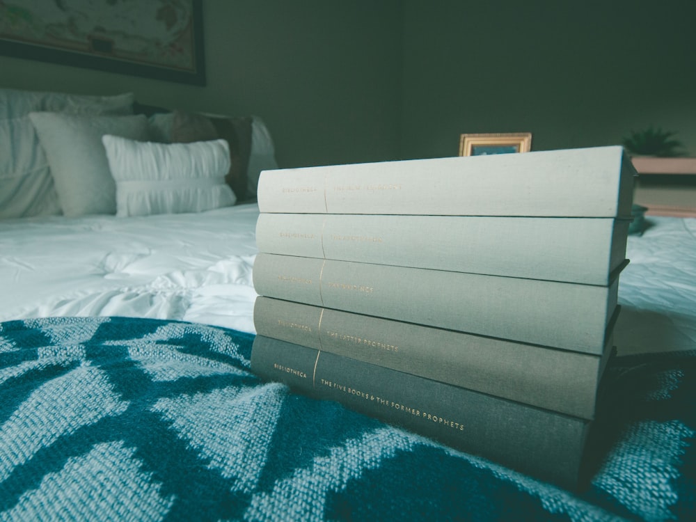 several books on blue bed comforter