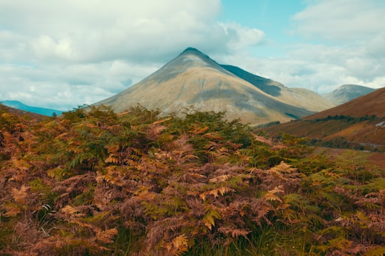 overlooking view of mountain beside white clouds in Scotland United Kingdom