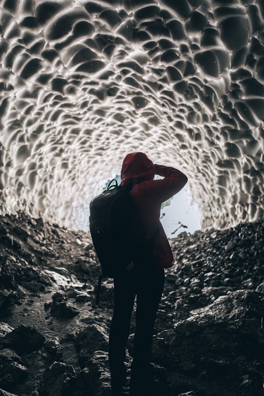 person wearing backpack inside cave in Königssee Germany