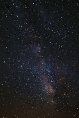 Cancer zodiac constellation in starry night sky with moon