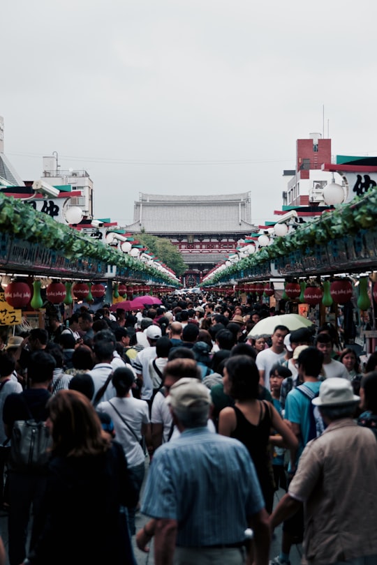 group of people going to temple in Sensō-ji Japan