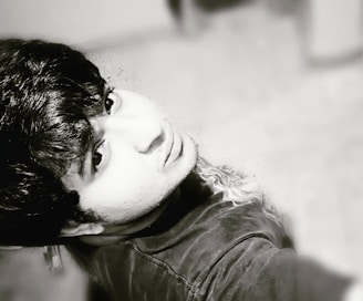 A large, clear portrait photograph showcasing natural light and expressive emotion.