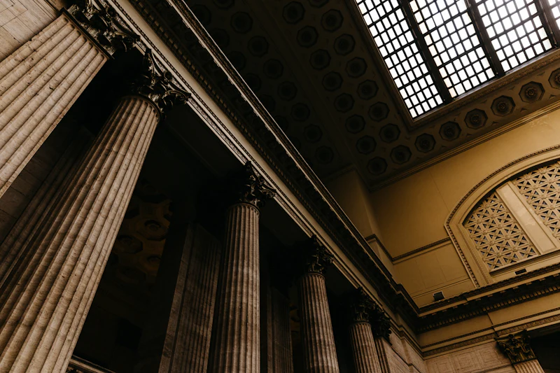 A quiet law office with afternoon light falling across a wide desk