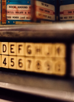 selective focus photo of alphabet and latter tile