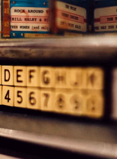 selective focus photo of alphabet and latter tile