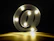Photo of a custom 3D printed illuminated sign glowing warmly in an office setting.