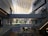 Bright, airy mall corridor with natural light and minimalist architectural elements.