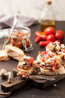 gray steel spoon on brown board