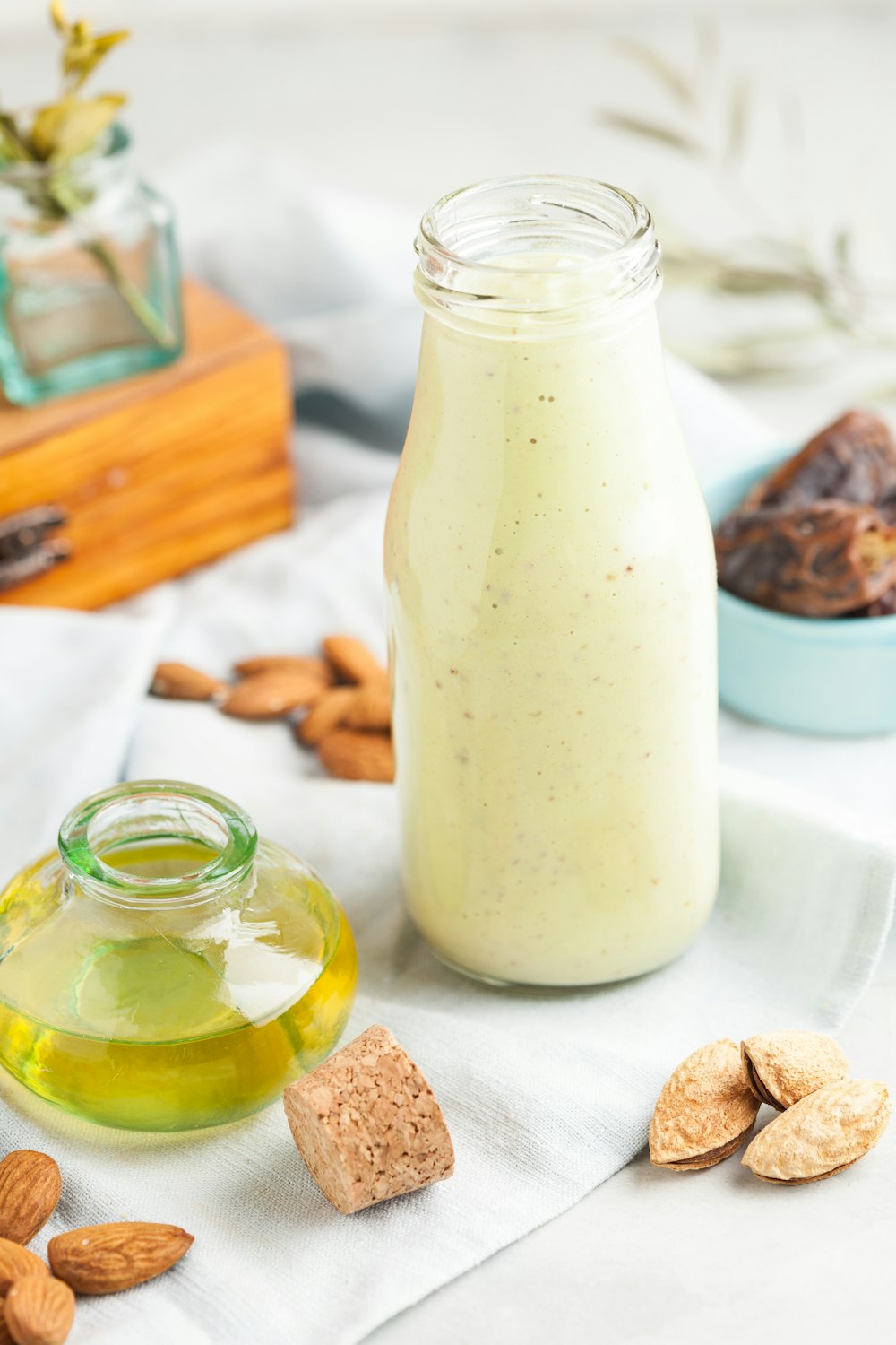 clear glass bottle on white cloth