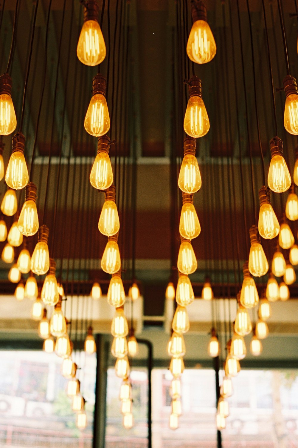 selective focus photography of light bulbs inside room