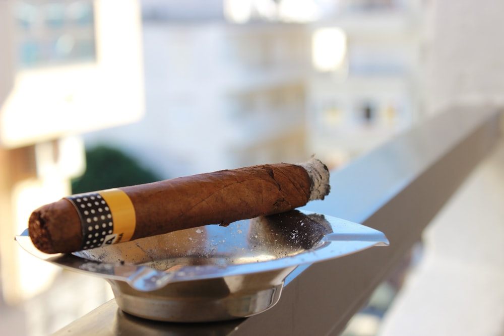 tobacco on top of gray ashtray