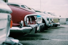 shallow focus photography of red car
