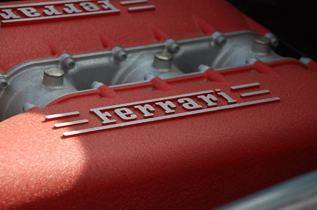 close-up photography of gray and red Ferrari engine