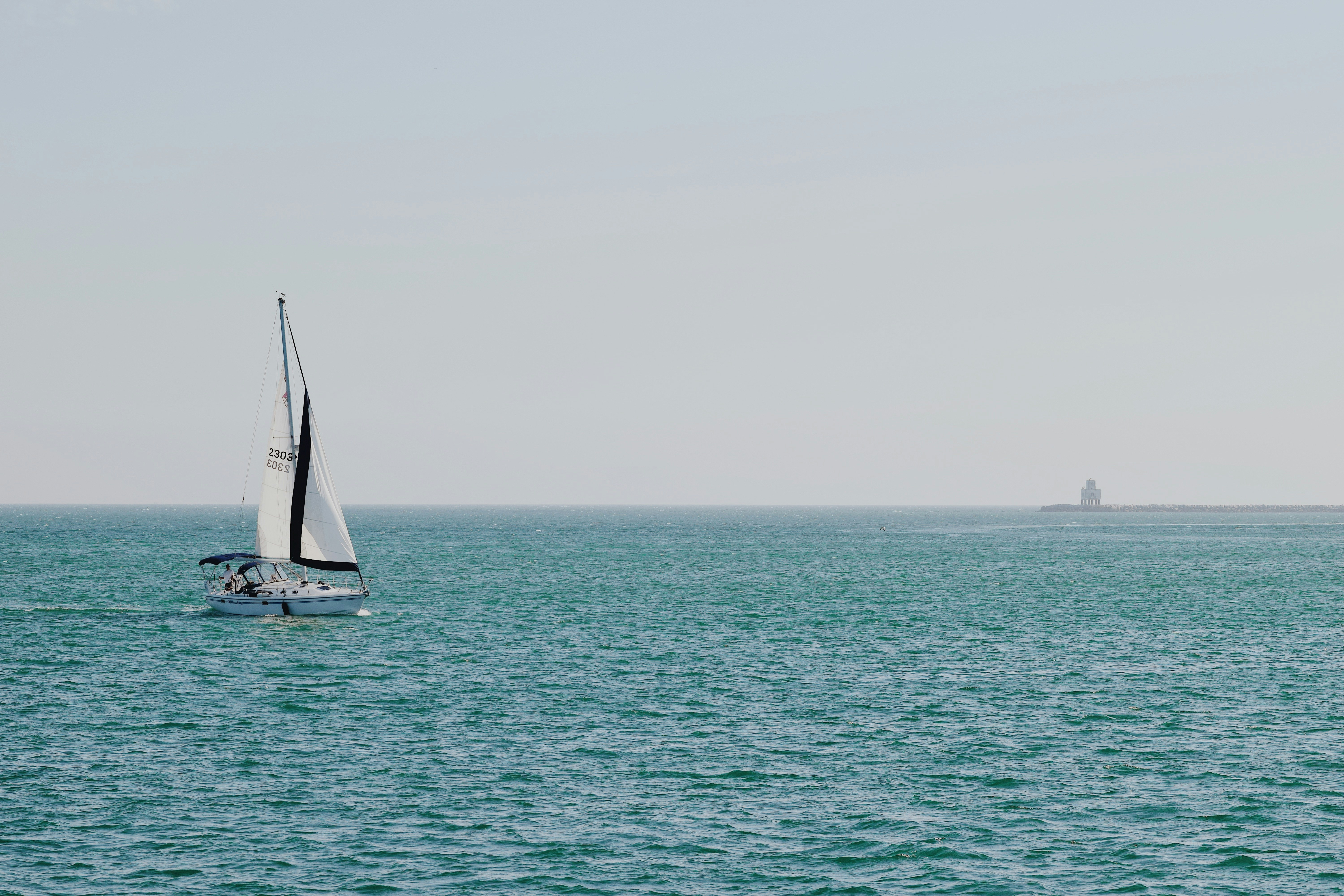 sailboat on body of water during daytime