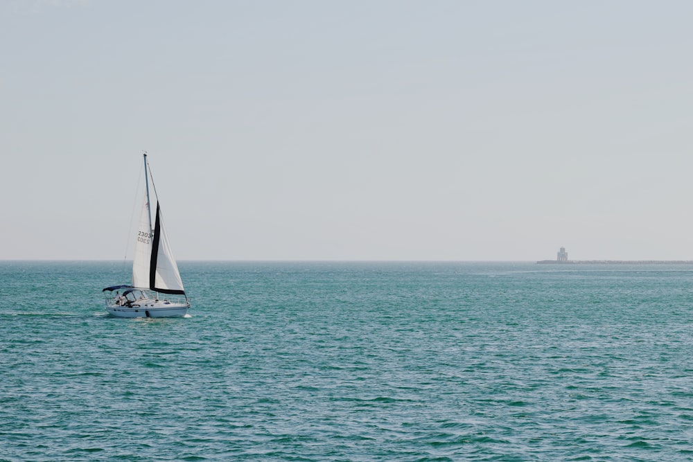sailboat on body of water during daytime