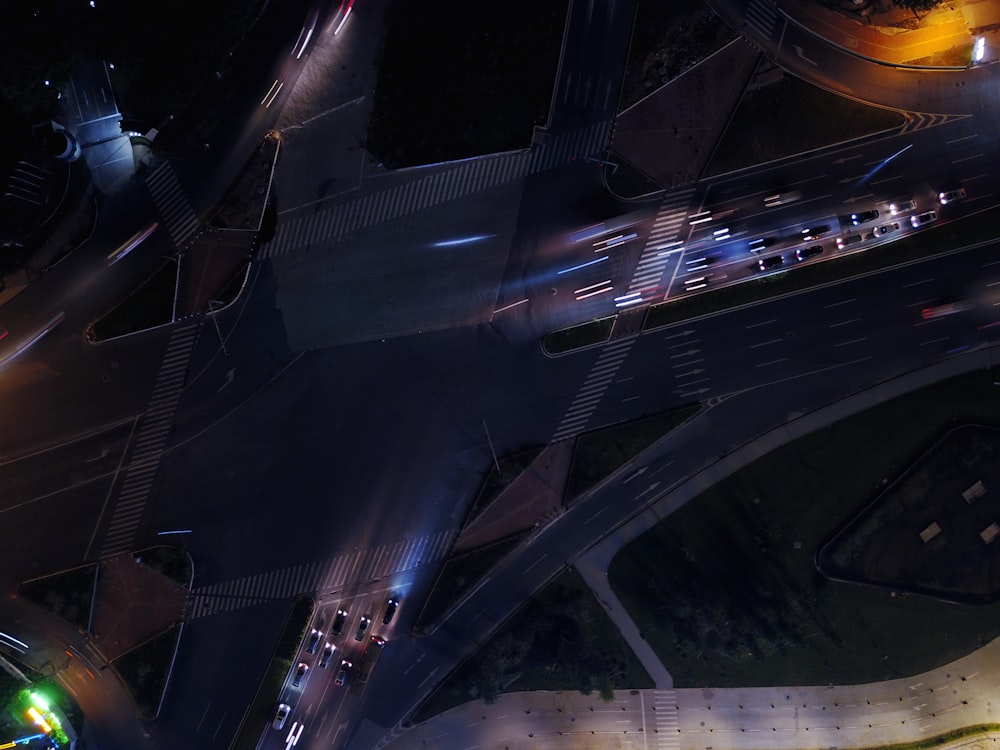 top view of concrete road with car lot on stop light