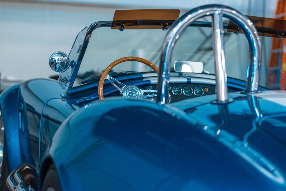 closeup photography of blue coupe at daytime