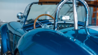 closeup photography of blue coupe at daytime