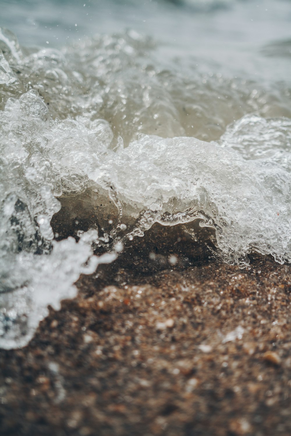 selective focus photography of water