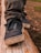 Side view of a person walking steadily on a balance beam during a physical therapy session.