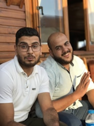 A friendly video call between two men sharing a lighthearted moment.