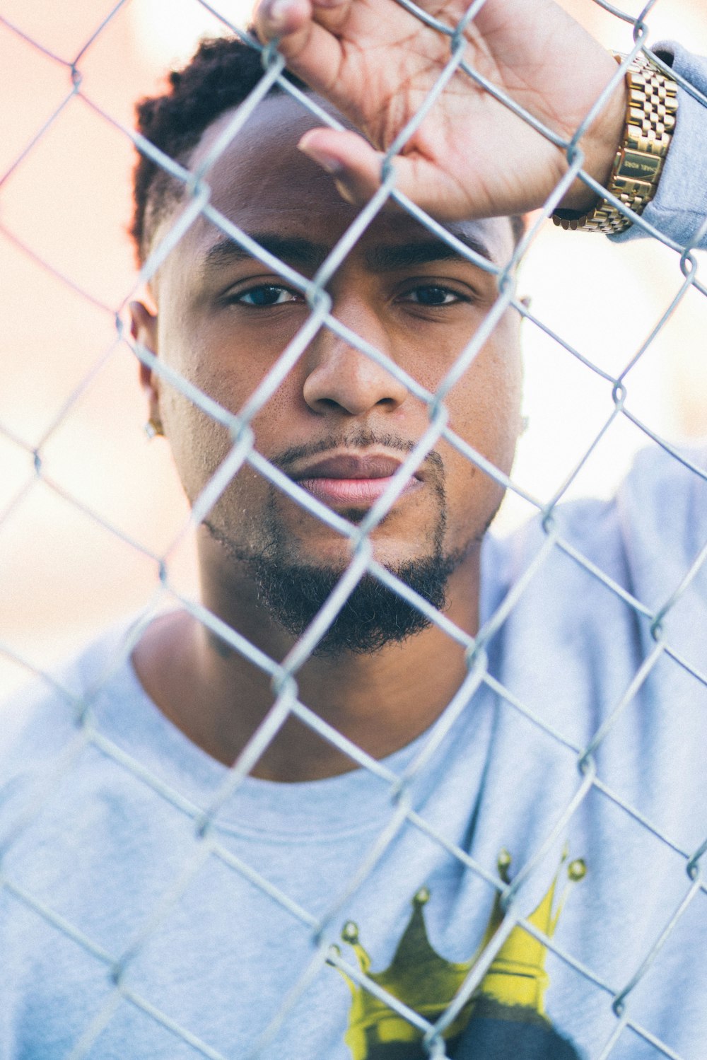 photography of man on the fence