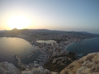 A panoramic view of Port Blair’s harbor with boats and the city skyline at dawn.