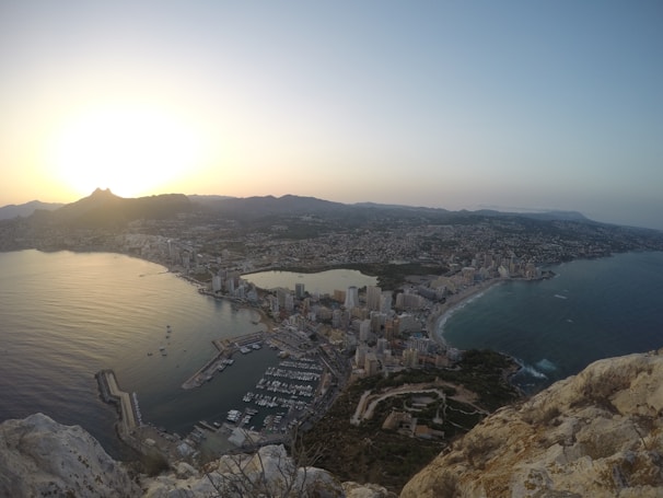 A panoramic view of Port Blair’s harbor with boats and the city skyline at dawn.