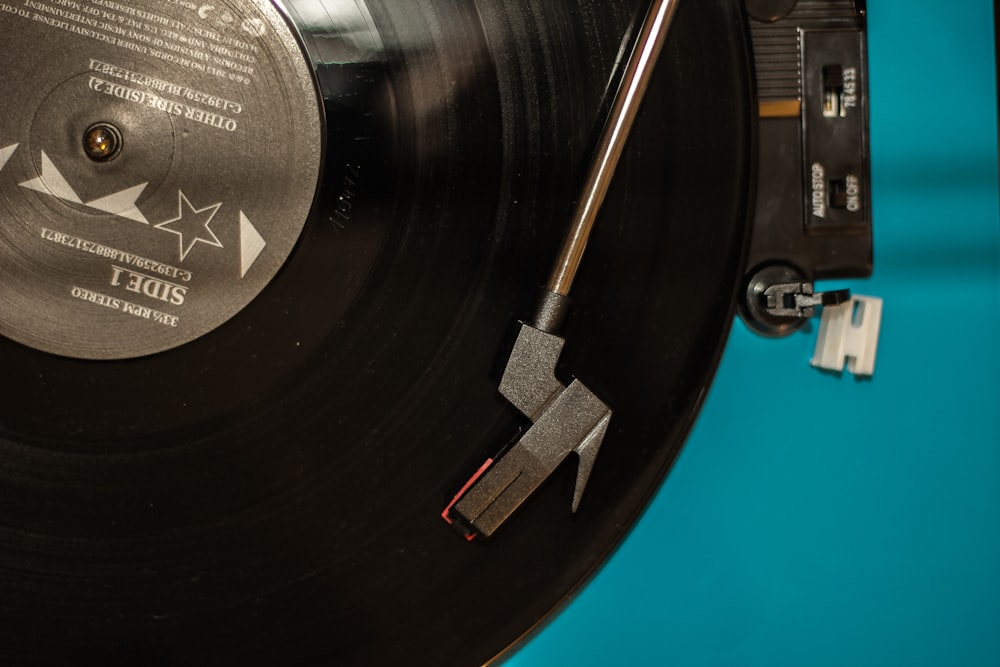black vinyl record on turntable