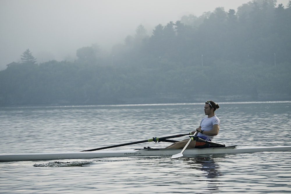 man riding on kayak