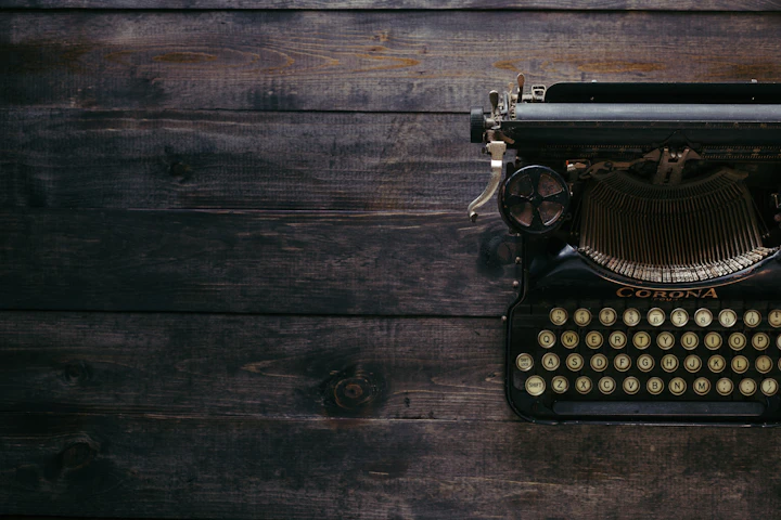 Vintage typewriter on wooden planks