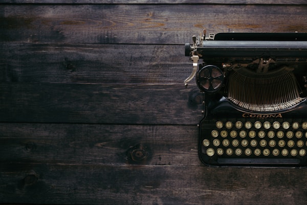 A person typing on a typewriter