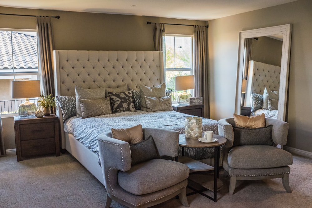 white wooden bed frame beside brown wooden table