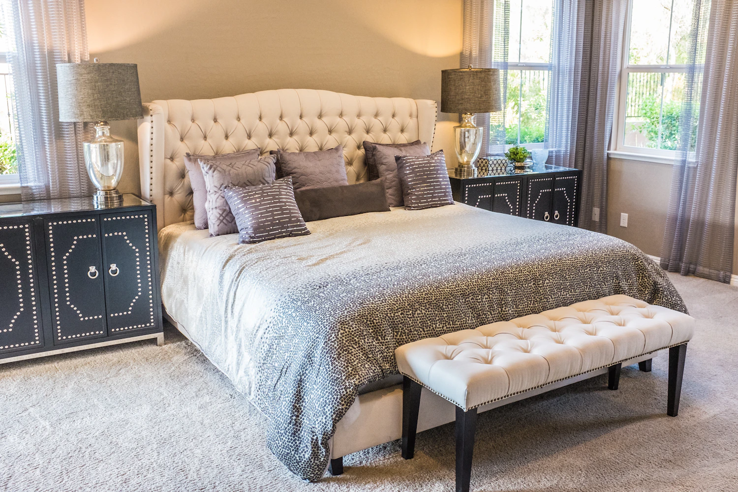 Guest room with bed and large windows