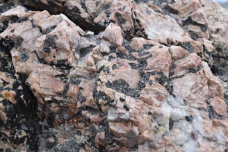Close-up of layered mafic and ultramafic igneous rock formations rich in platinum group minerals
