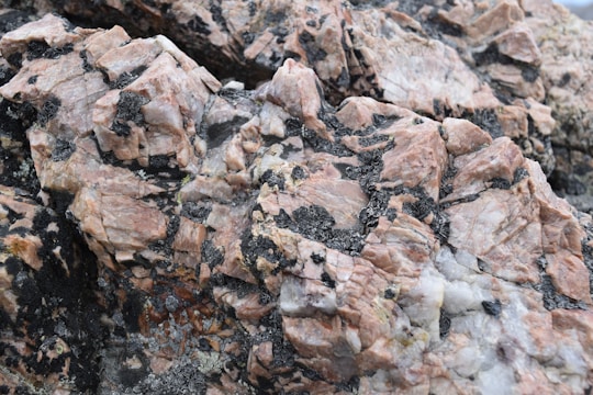 Close-up of layered mafic and ultramafic igneous rock formations rich in platinum group minerals
