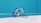 white road bike leaning on teal wooden wall during daytime