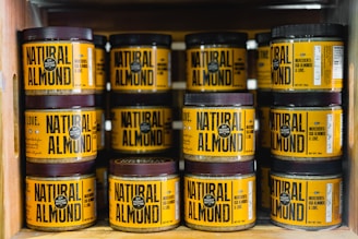 pile of Natural Almond bottles