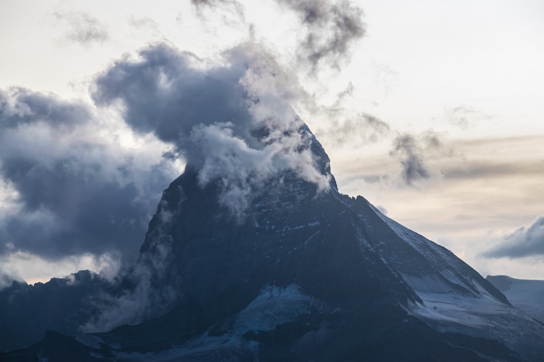 mountain near clouds during daytime