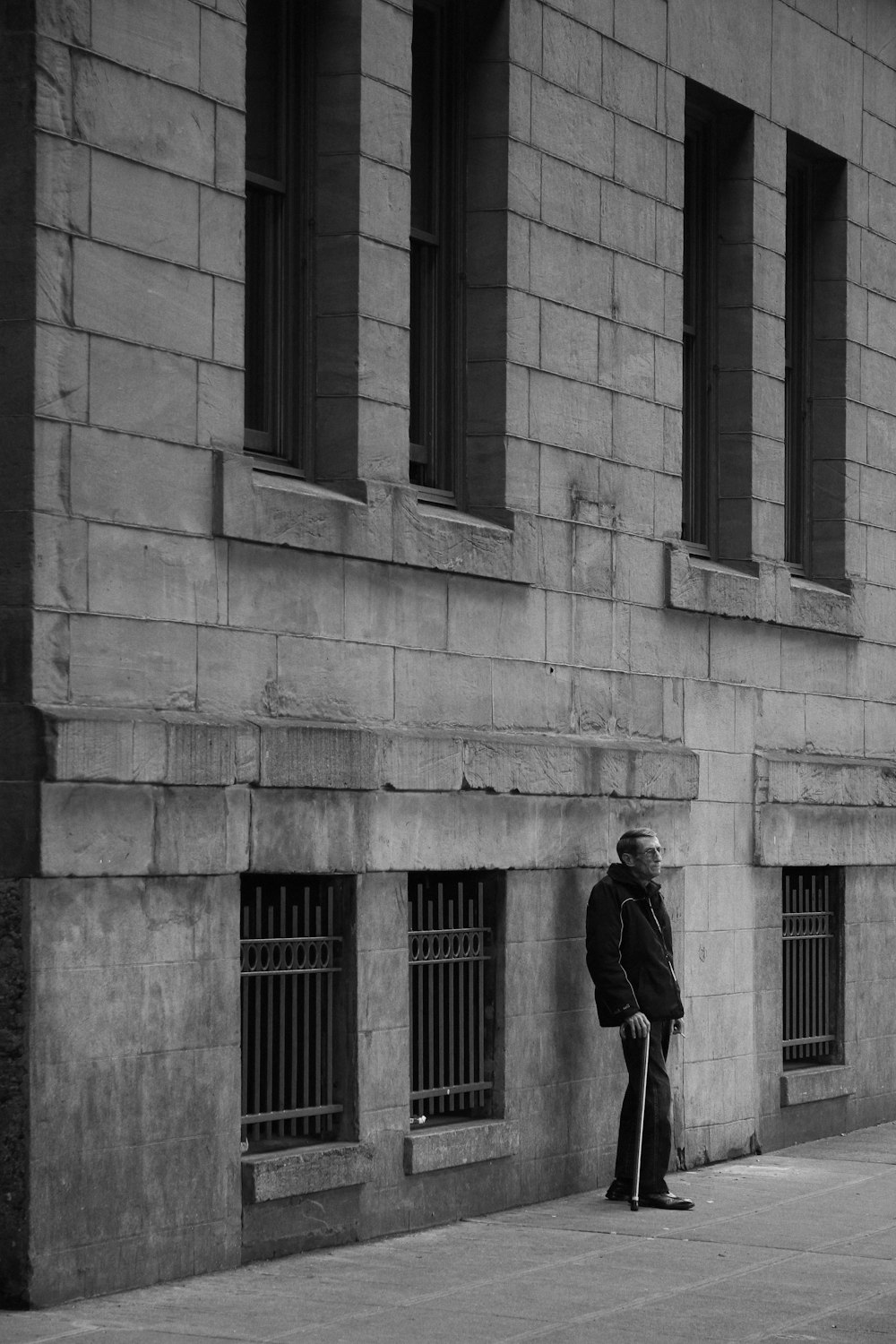 man standing near a wall