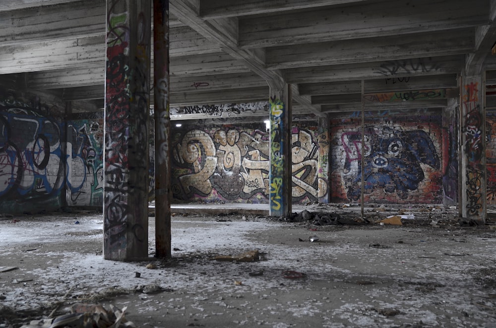 gray concrete building with graffiti on walls